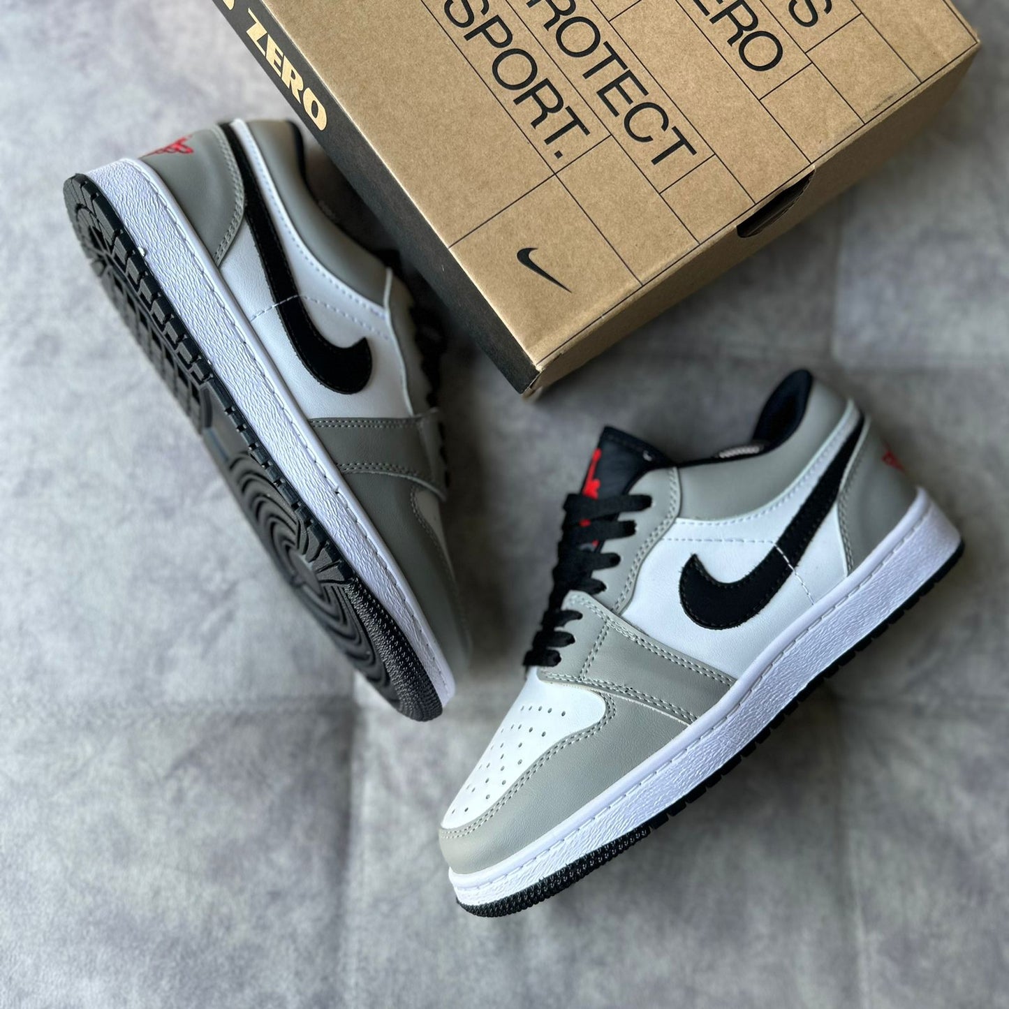 JORDAN 1 LOW - GRIS/NEGRO